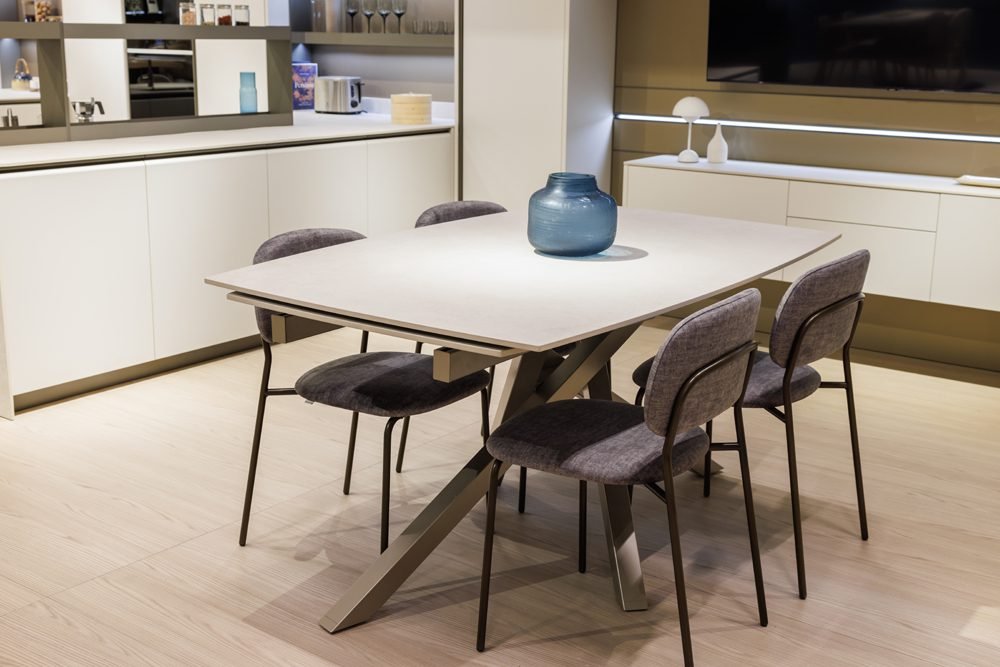 Custom Italian cabinetry integrated into dining and living space with modern materials and seamless design flow