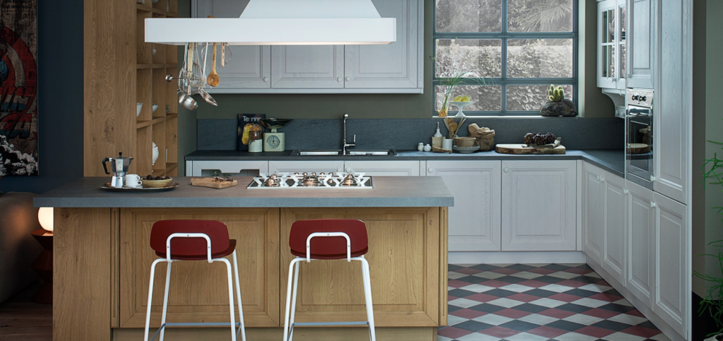 Classic kitchen with white upper cabinets, wood shelving, blue-gray backsplash, large window, sink area, and warm European kitchen details.