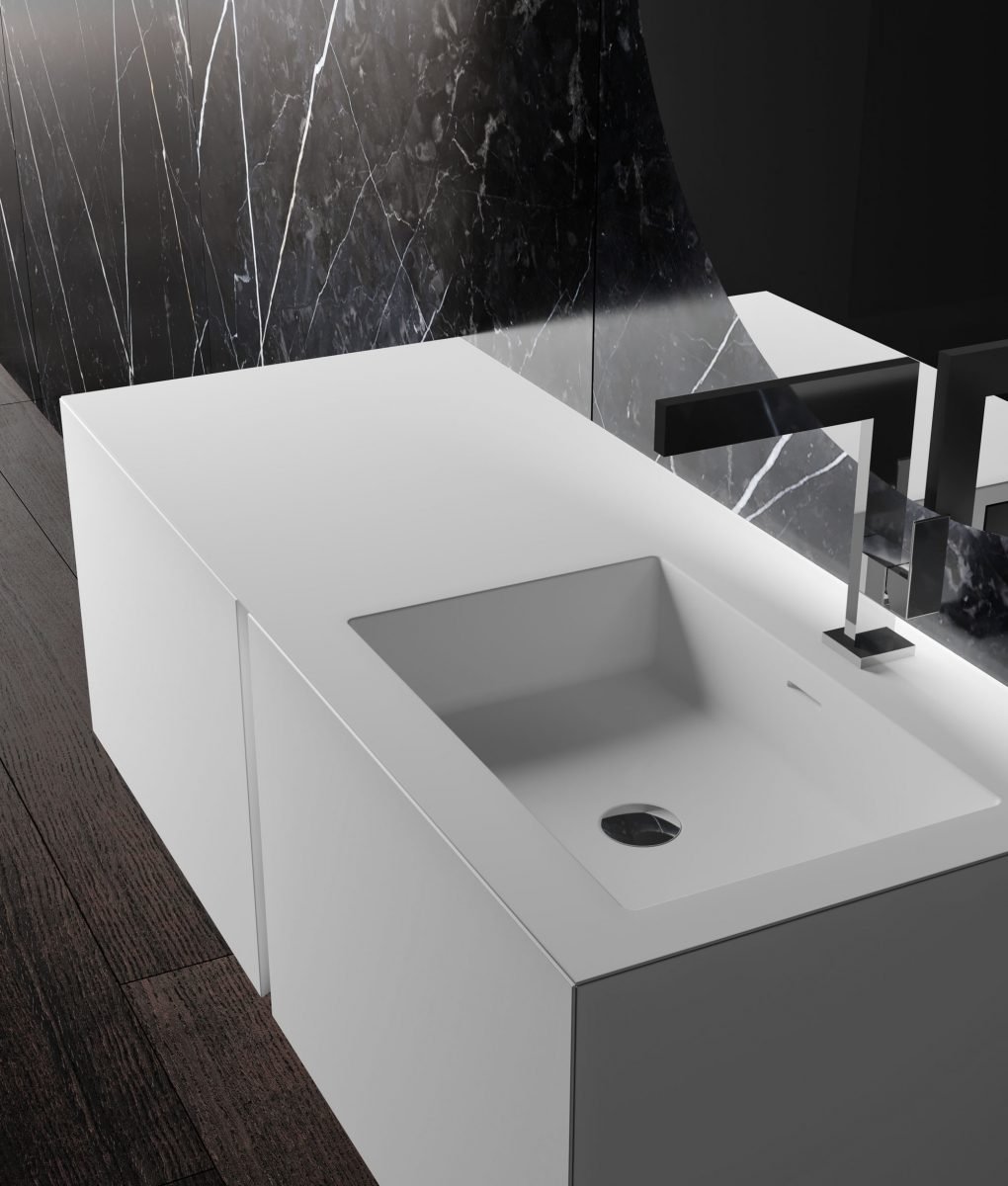Modern Italian bathroom vanity with integrated sink, stone backsplash, and custom cabinetry design