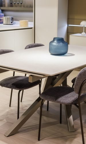 Custom Italian cabinetry integrated into dining and living space with modern materials and seamless design flow