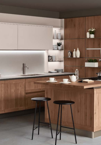 Modern Italian kitchen with natural wood cabinetry, white cabinet fronts, large island, open shelving, integrated storage, and contemporary bar seating.
