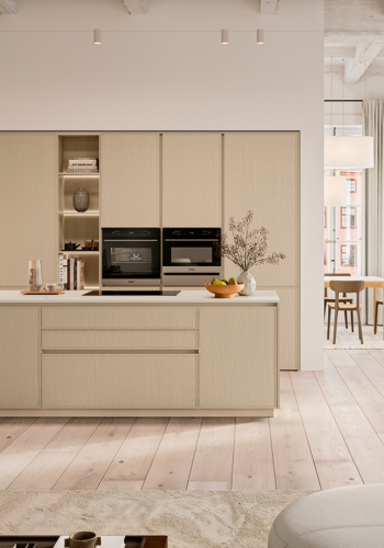 3D kitchen rendering with light wood cabinetry, integrated appliances, open shelving, large island, soft neutral finishes, and bright natural light.
