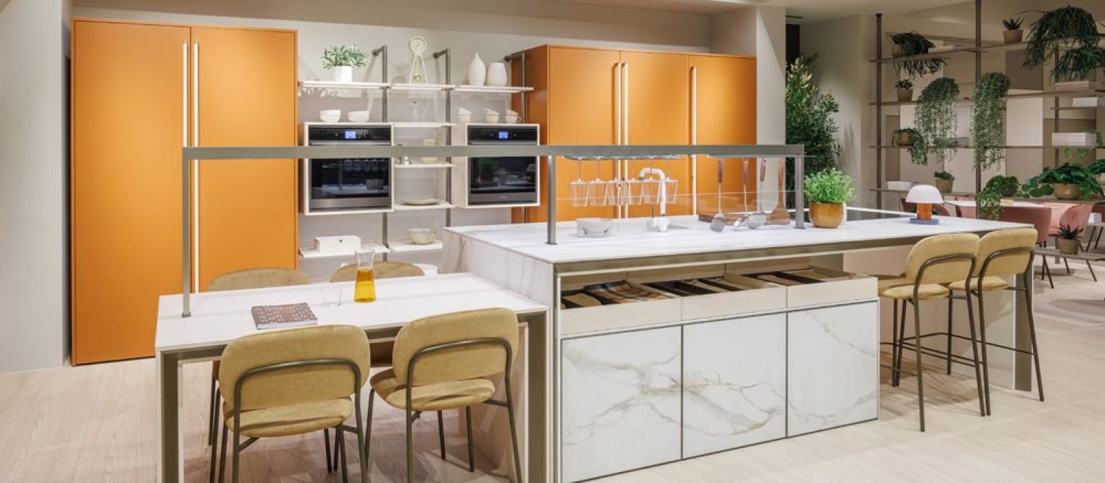 Kitchen and bath showrooms near me featuring luxury Italian orange cabinetry, marble island, premium appliances, and modern European kitchen design.