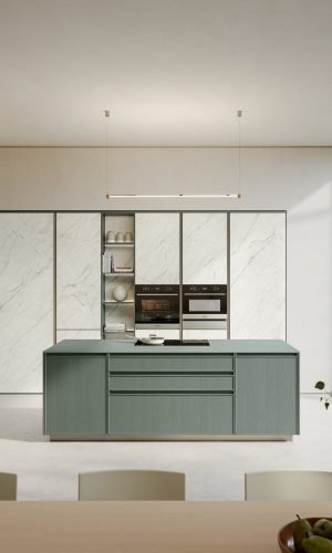 Timeless Italian kitchen with soft green island cabinetry, marble cabinet fronts, open shelving, integrated ovens, and large glass doors to the garden
